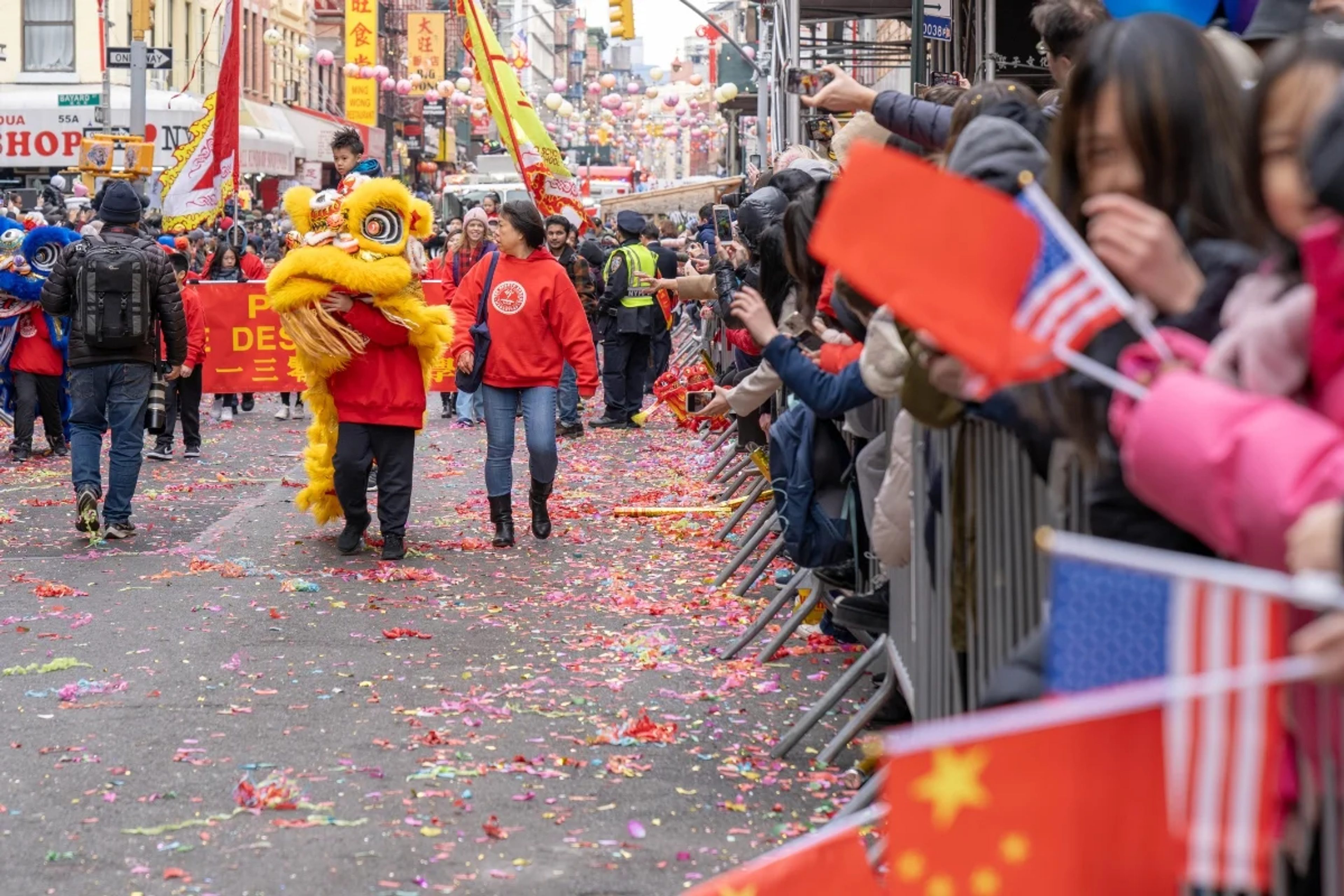 Lion and spectators at the Lunar New Year Parade in New York's Chinatown