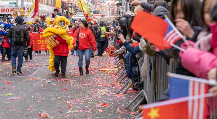 Lion and spectators at the Lunar New Year Parade in New York's Chinatown