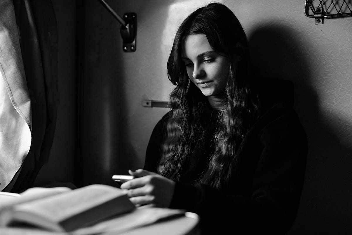 Young woman studying using mobile app