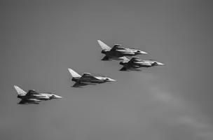 Four fighter jets flying in formation