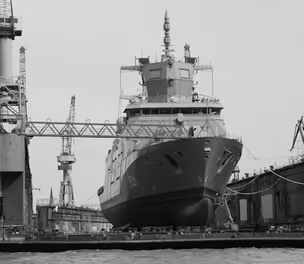 Modern ship under construction in shipyard showcasing advanced shipbuilding and maritime engineering technology