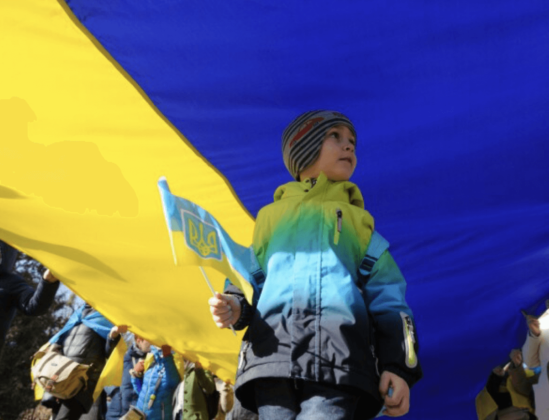 A child holding the Ukrainian flag