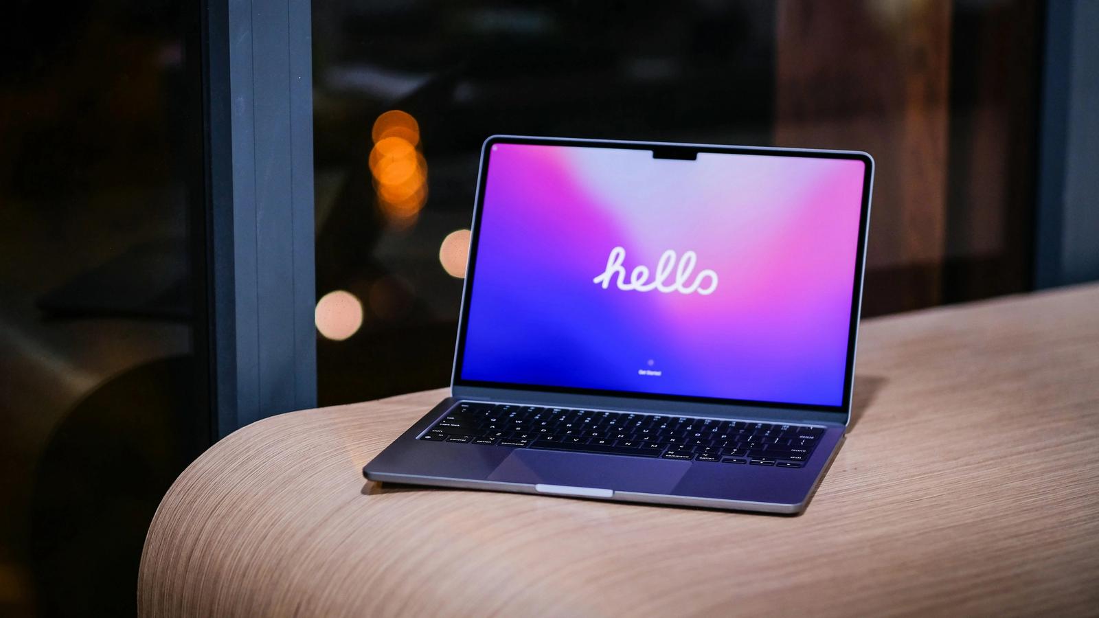 Laptop screen showing early product design work for a finance app