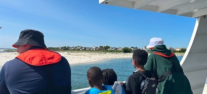 An image of Community Offshore Wind team members and New York students on a fishing trip