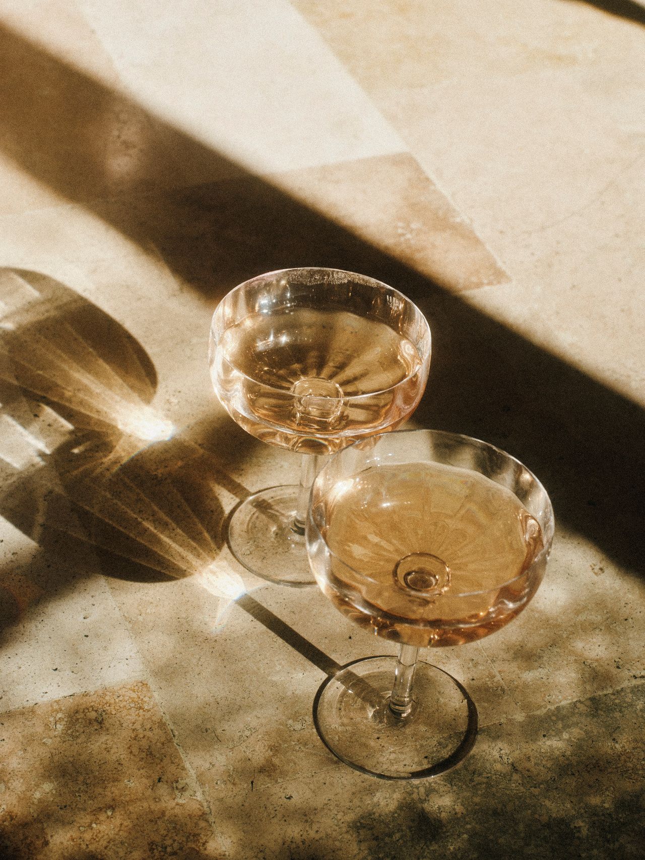 Two glasses of rosé in warm sunlight