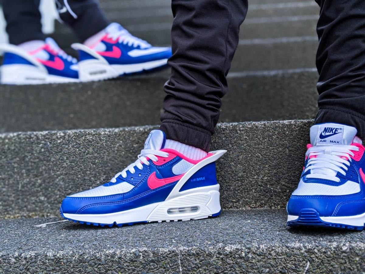 Blue and pink Nike Air Max 90s with the visible air window in the white sole.