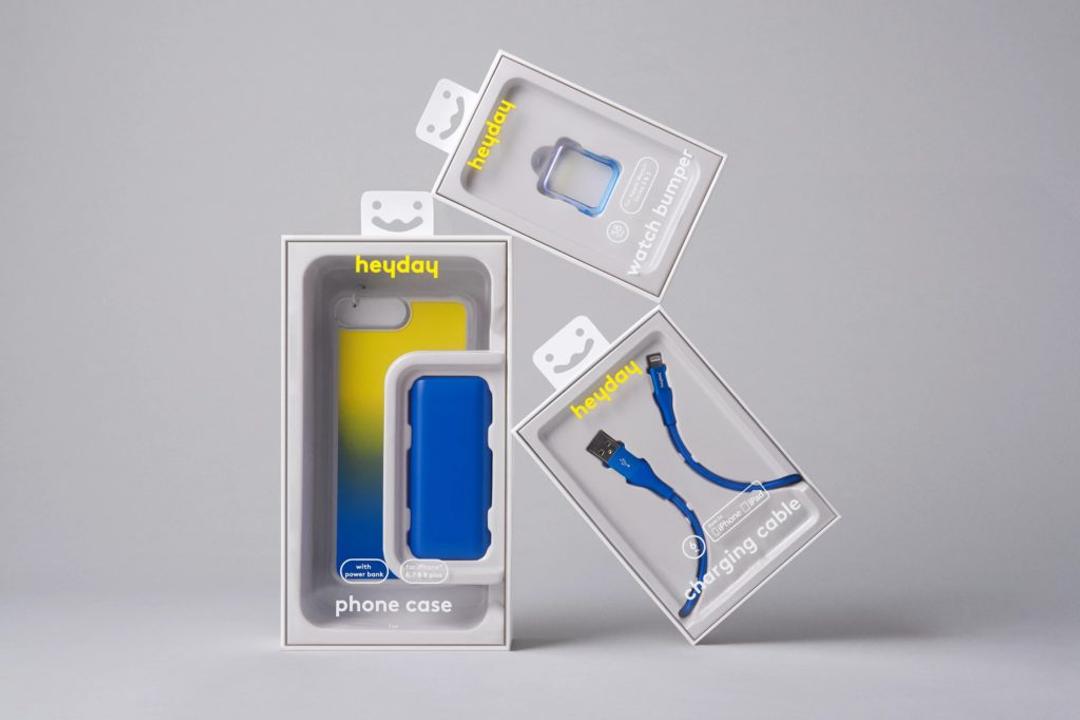 Heyday packaging for a phone case, watch bumper and charging cable, in blue and yellow