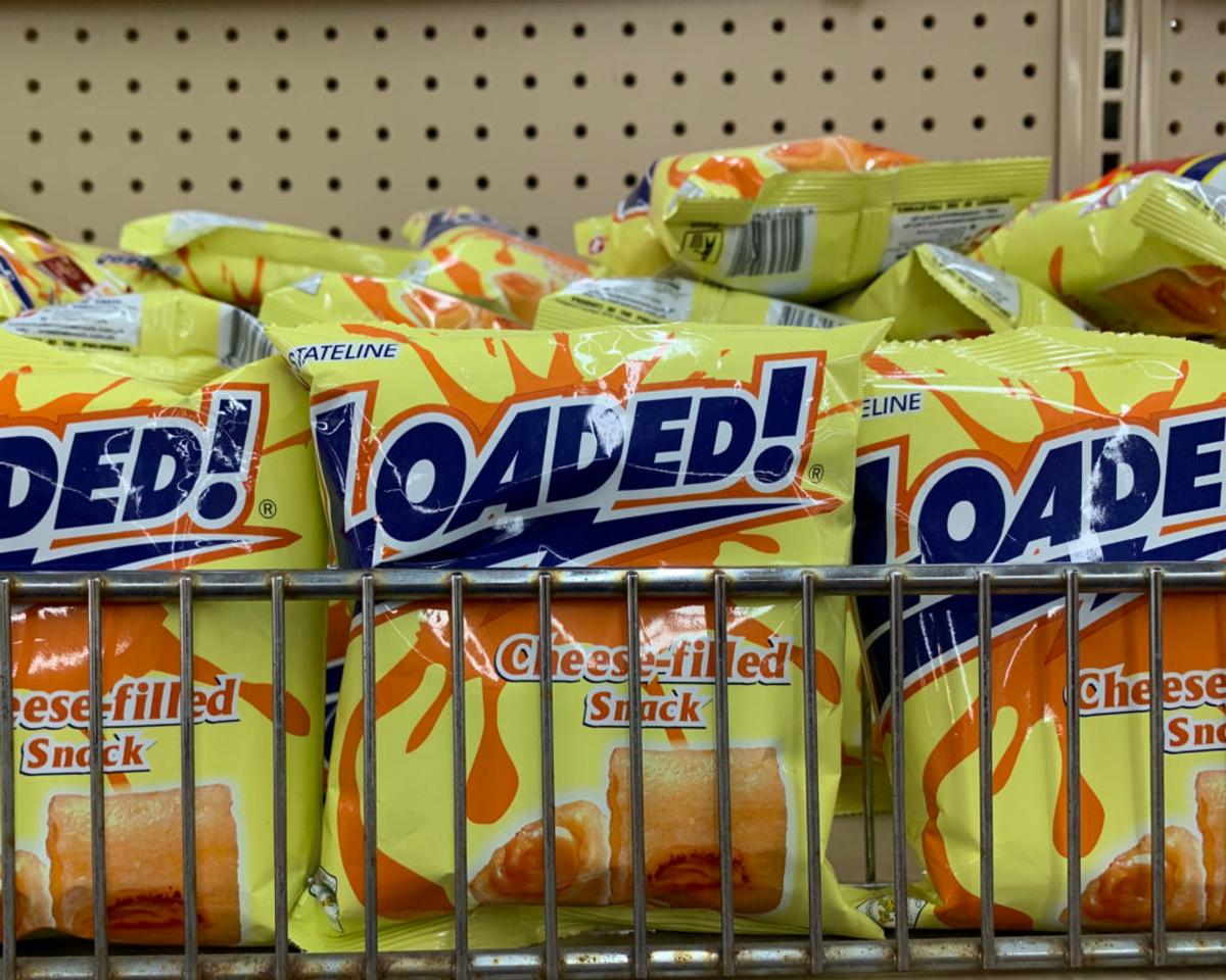 Store shelf of yellow bags reading "Stateline LOADED!" and "Cheese-filled Snack."