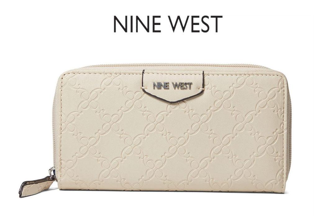 A cream embossed zip wallet under the "Nine West" logo.