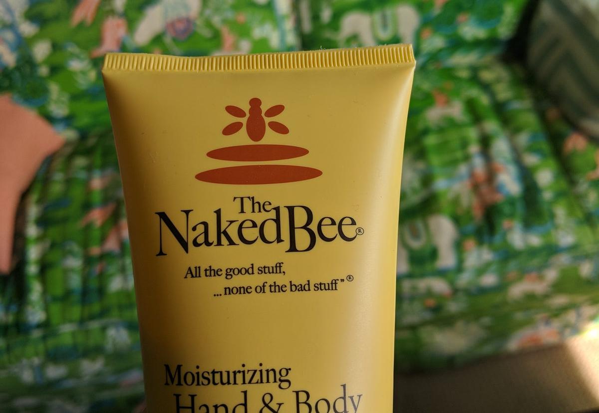 Yellow tube reading "The Naked Bee — All the good stuff, ...none of the bad stuff" above "Moisturizing Hand & Body."