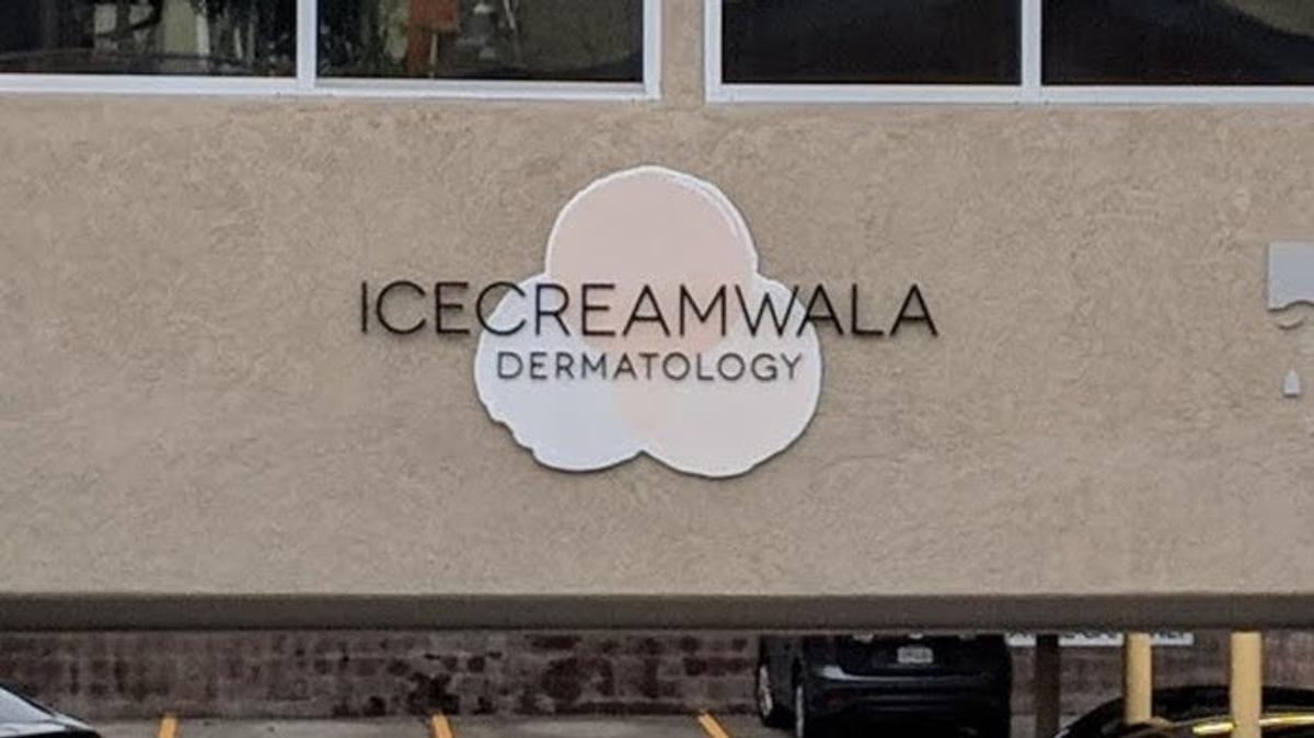 Storefront sign reading "Icecreamwala Dermatology" over a cloud-shaped logo.