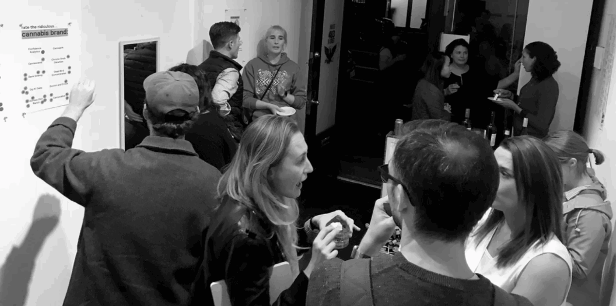 Guests at a party placing stickers on a wall poster headed "rate the ridiculous... cannabis brand."