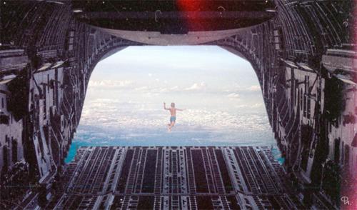 A figure leaping from the open cargo ramp of a plane high above the clouds.