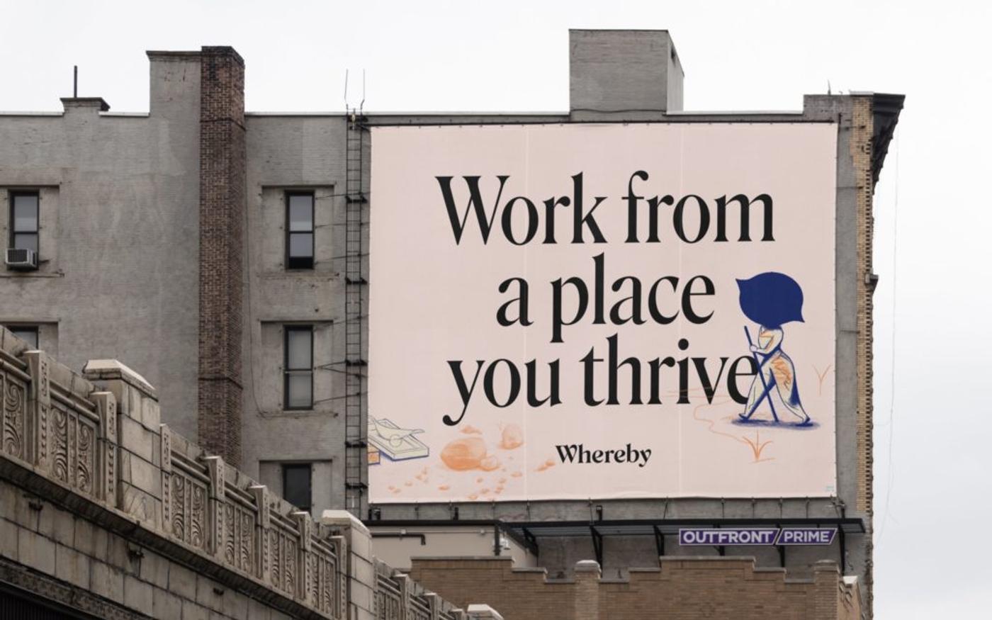 A Whereby billboard reading "Work from a place you thrive" on the side of a building