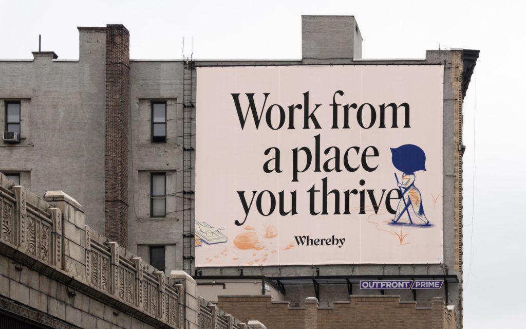 A Whereby billboard reading "Work from a place you thrive" on the side of a building
