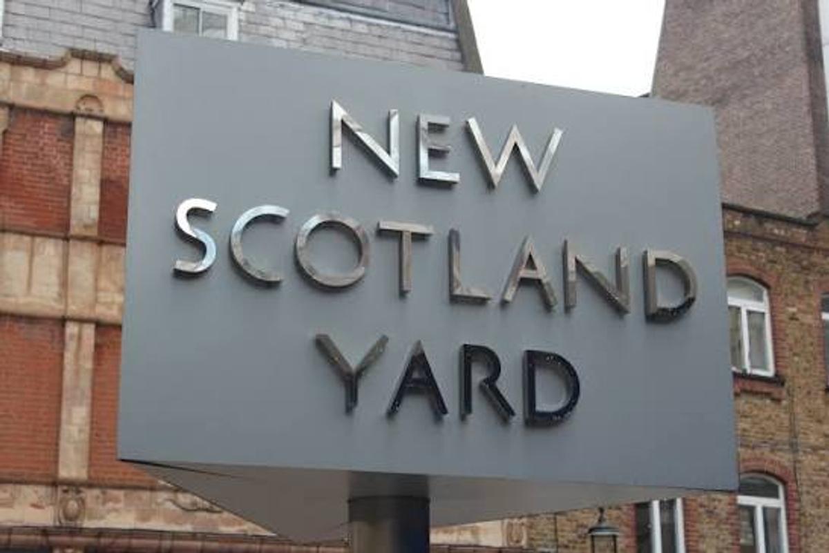 The rotating "New Scotland Yard" sign outside police headquarters in London.