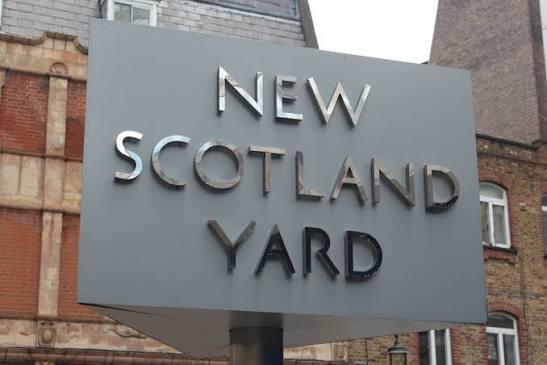 The rotating "New Scotland Yard" sign outside police headquarters in London.
