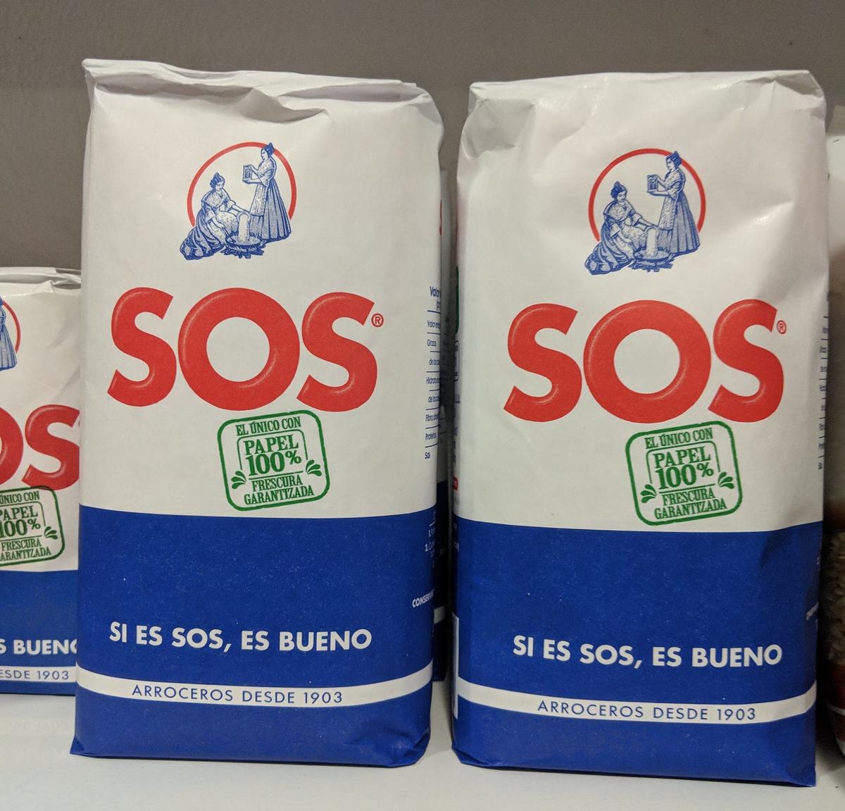 Bags of Spanish rice branded "SOS" in red, with "Si es SOS, es bueno" and "Arroceros desde 1903."