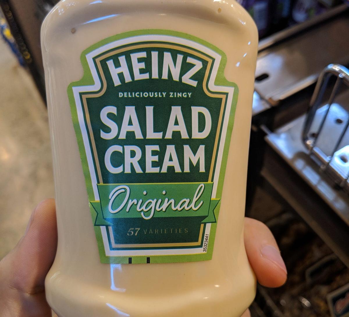 A bottle of Heinz "Deliciously Zingy Salad Cream Original," 57 Varieties.