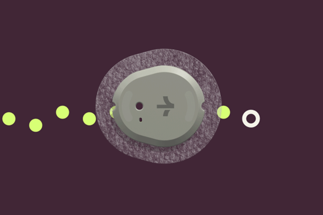 An illustration of a round biosensor, a trail of green dots running through it