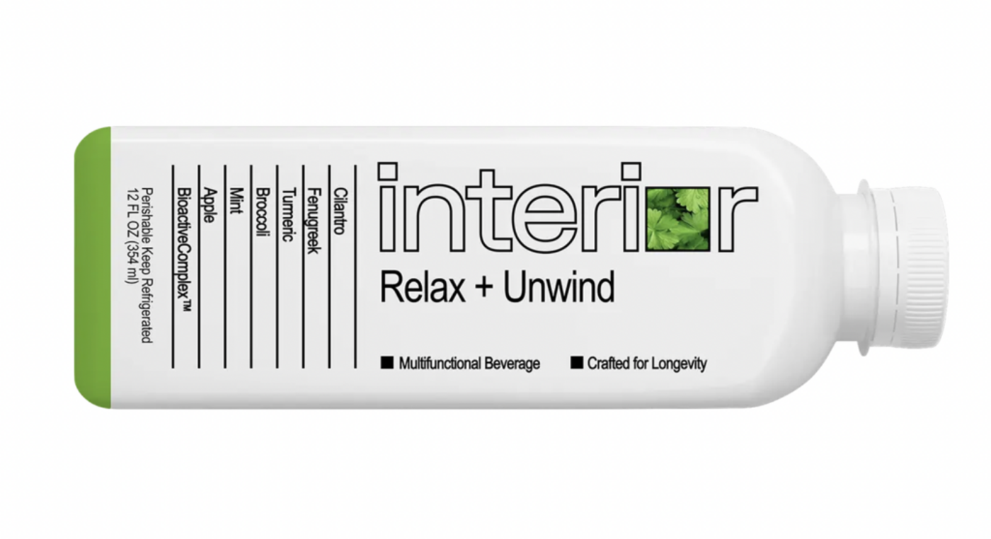 An Interior bottle, "Relax + Unwind", its ingredients listed down one side
