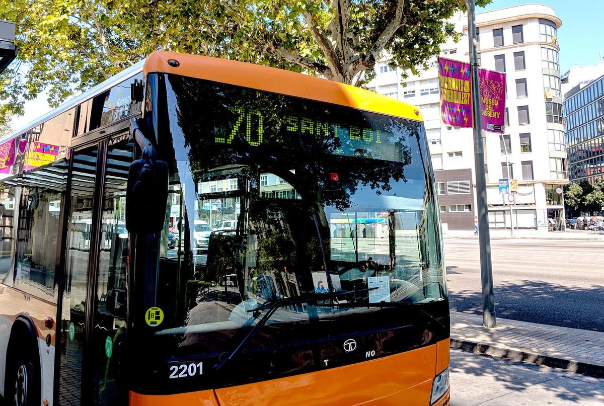 Orange city bus in Barcelona with a destination sign reading "L70 SANT BOI."
