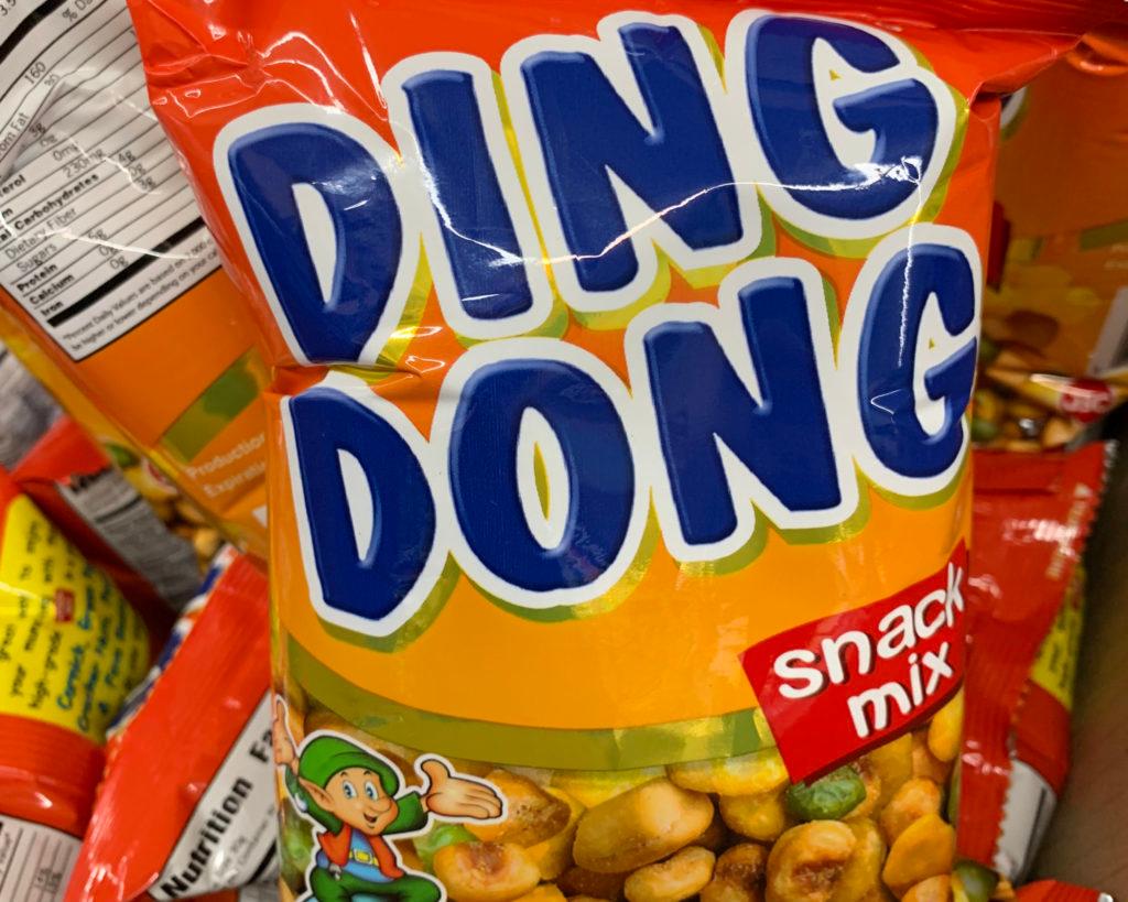 Orange bag of "Ding Dong" snack mix, with a green-hatted elf beside a pile of nuts.