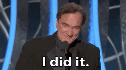 Quentin Tarantino smirking at a microphone with the caption "I did it."
