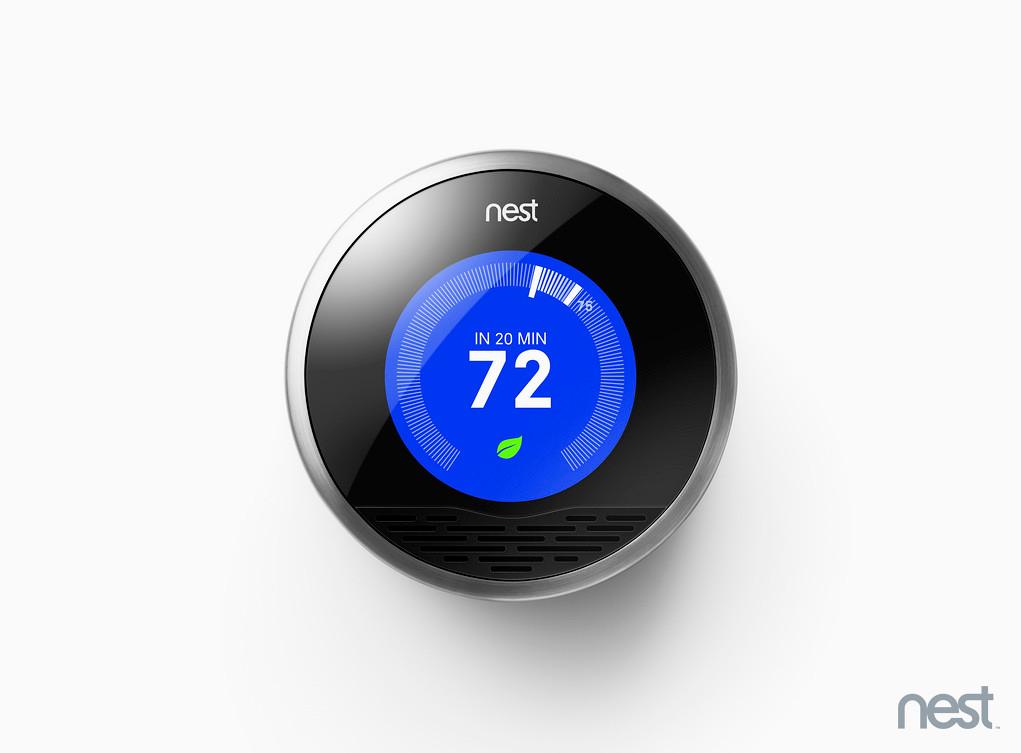 Nest thermostat, its blue dial showing "IN 20 MIN 72" beneath the "nest" wordmark.