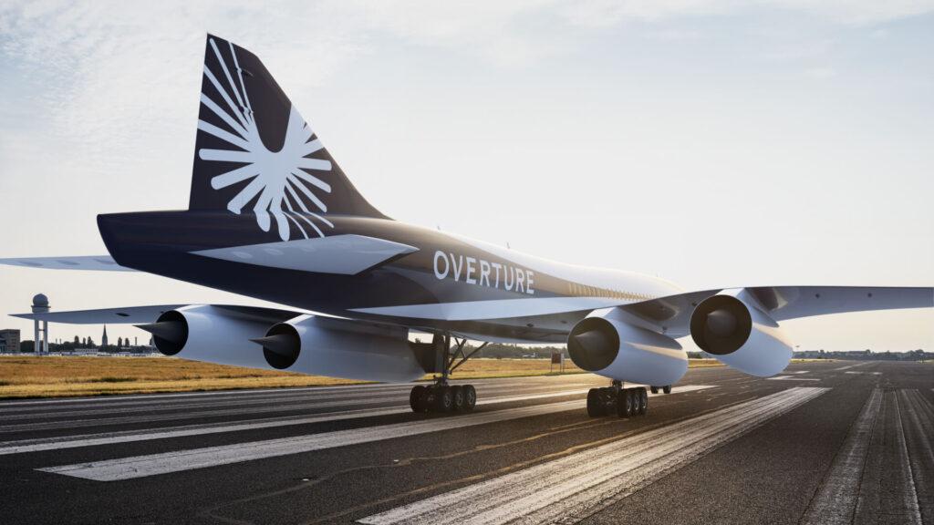 The Overture supersonic airliner on a runway at dawn, its name along the fuselage
