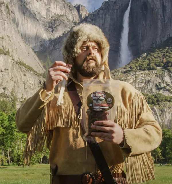 Old trapper eating jerky in Yosemite