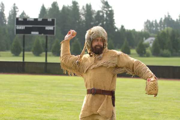 Old Trapper throwing a baseball