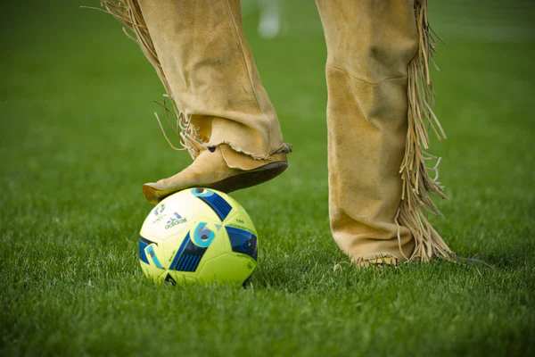 Old Trapper playing soccer on the turf of Providence Park