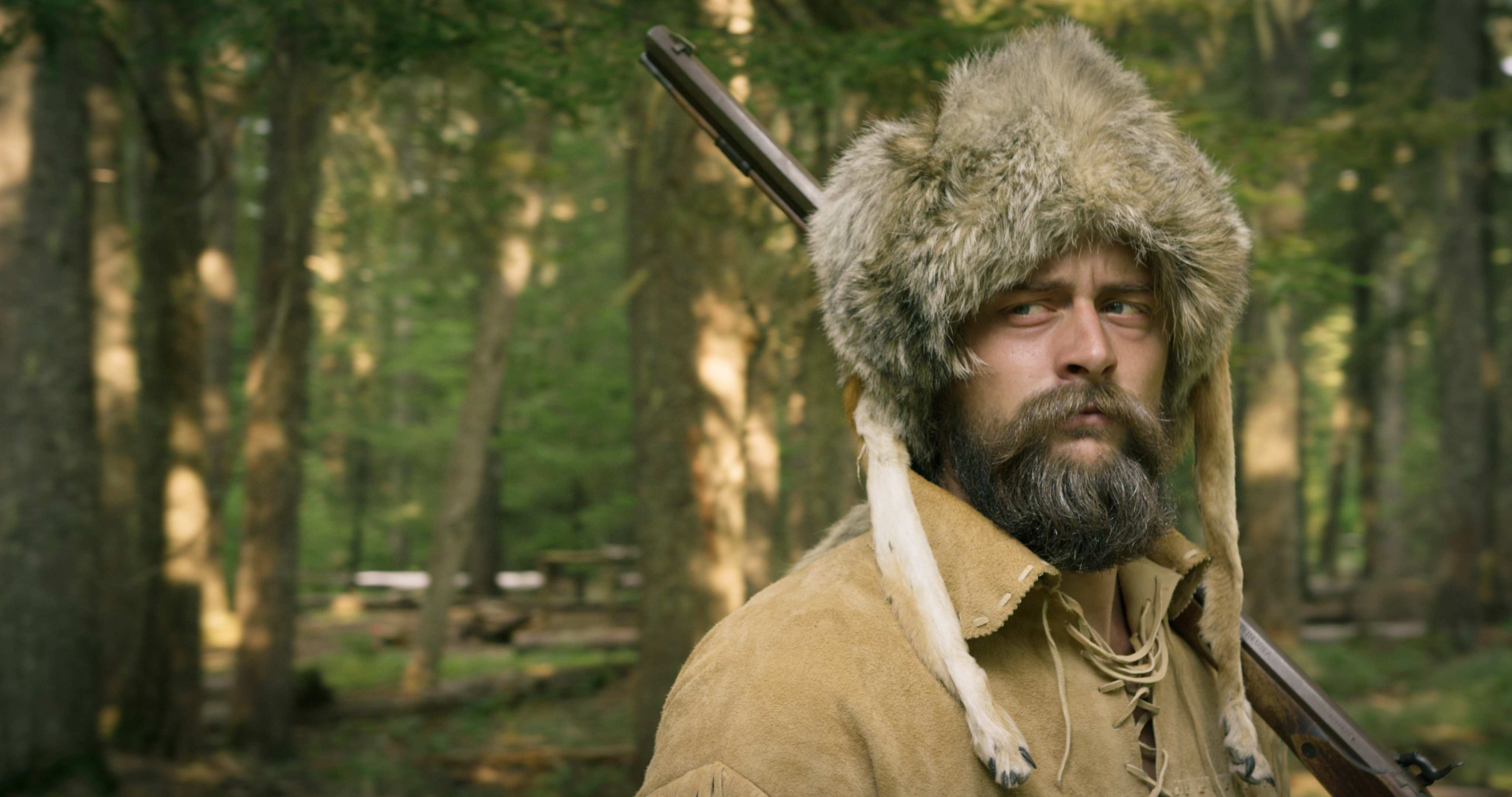 Old Trapper In Forest
