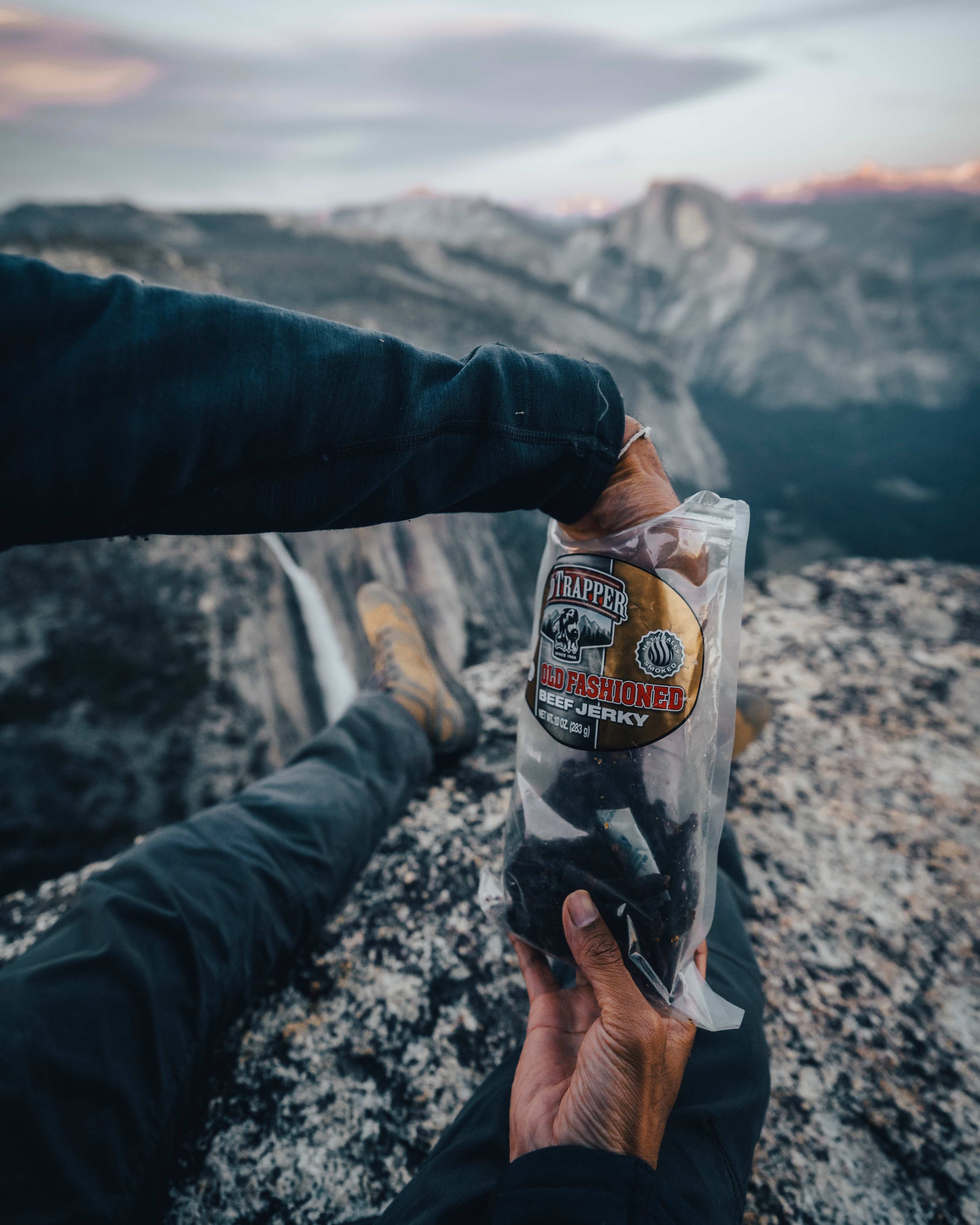 hikers with a view holding a bag of Old fashioned beef jerk 