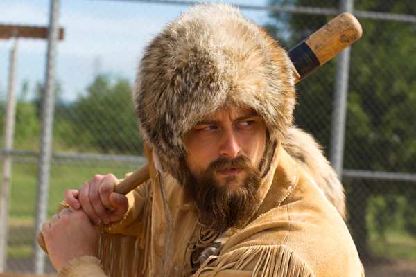 Old Trapper playing baseball, up to bat with an old wooden bat