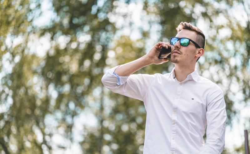 A business man is on his phone.