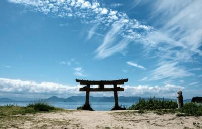 Torii Gate in Japan near the ocean with islands