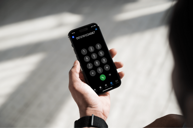 holding phone dialing to San Antonio, TX from Mexico