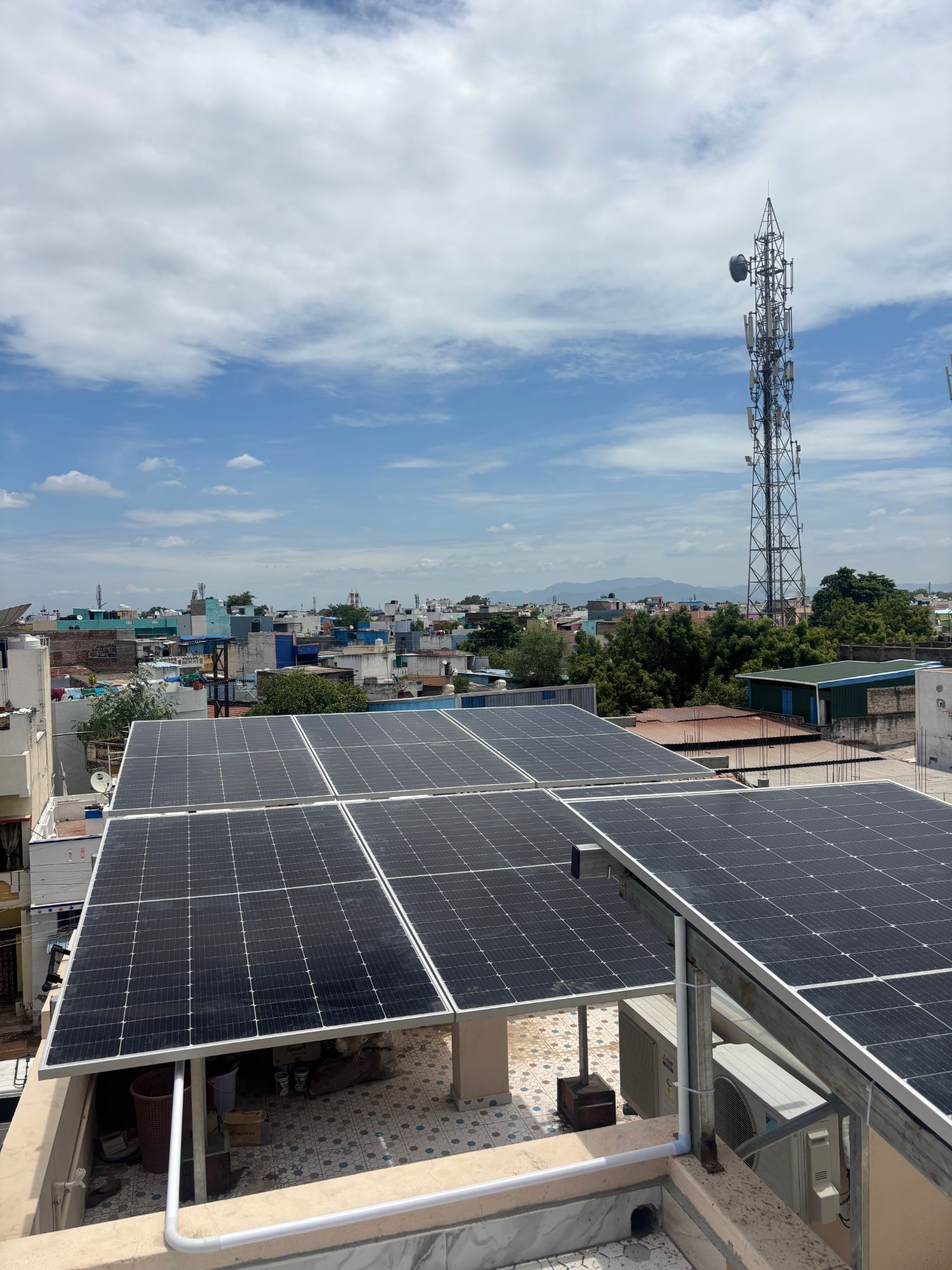 Rooftop solar against the Madurai skyline