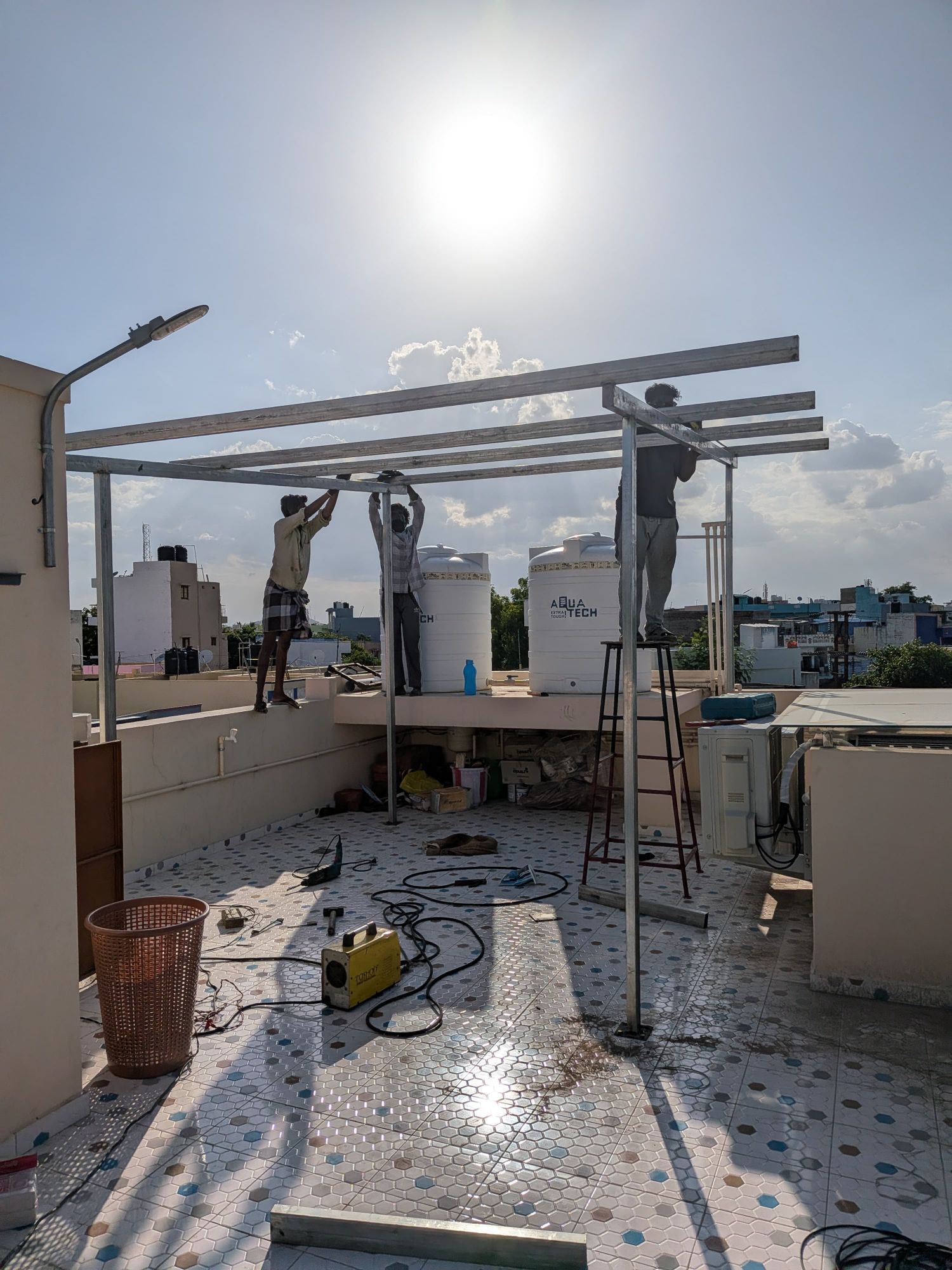 Our own crew building the mounting frame — Madurai