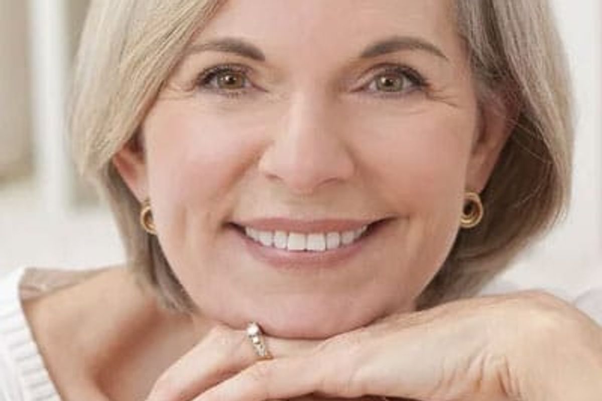 A woman smiling.