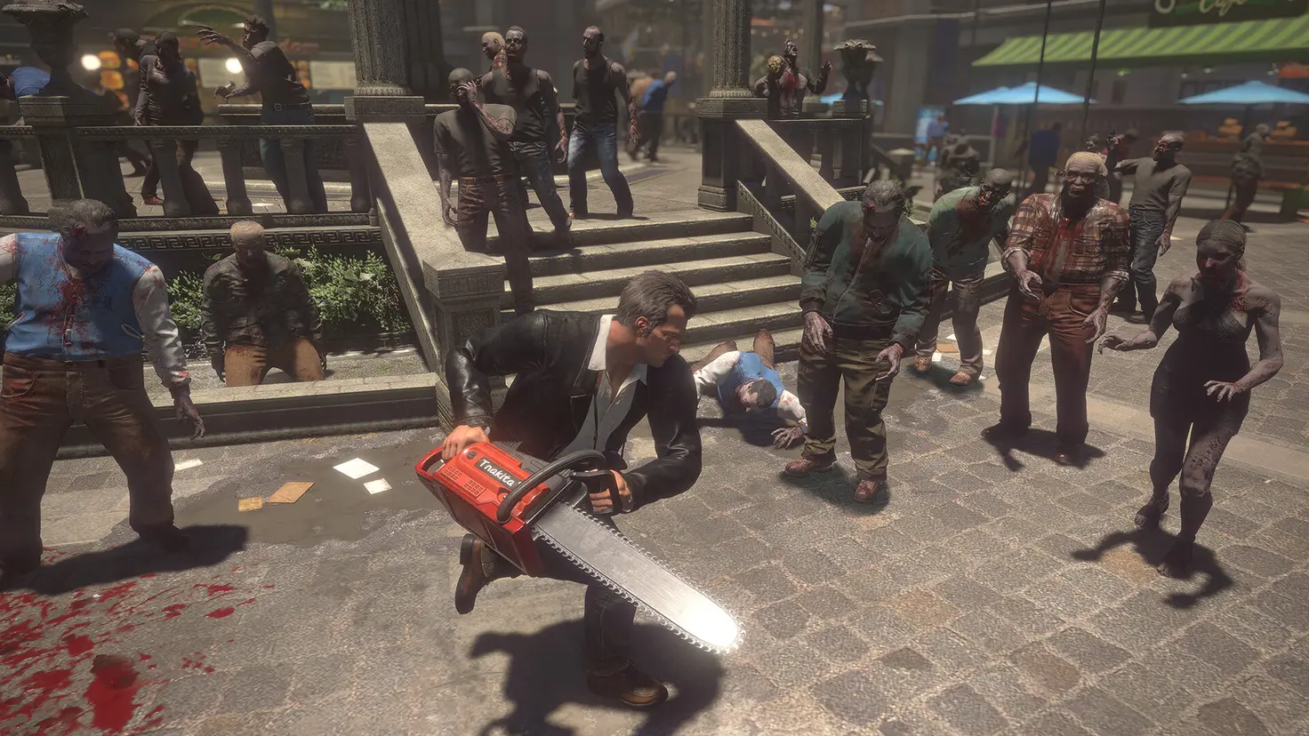 Frank West swings a chainsaw at a horde of zombies in Dead Rising Deluxe Remaster