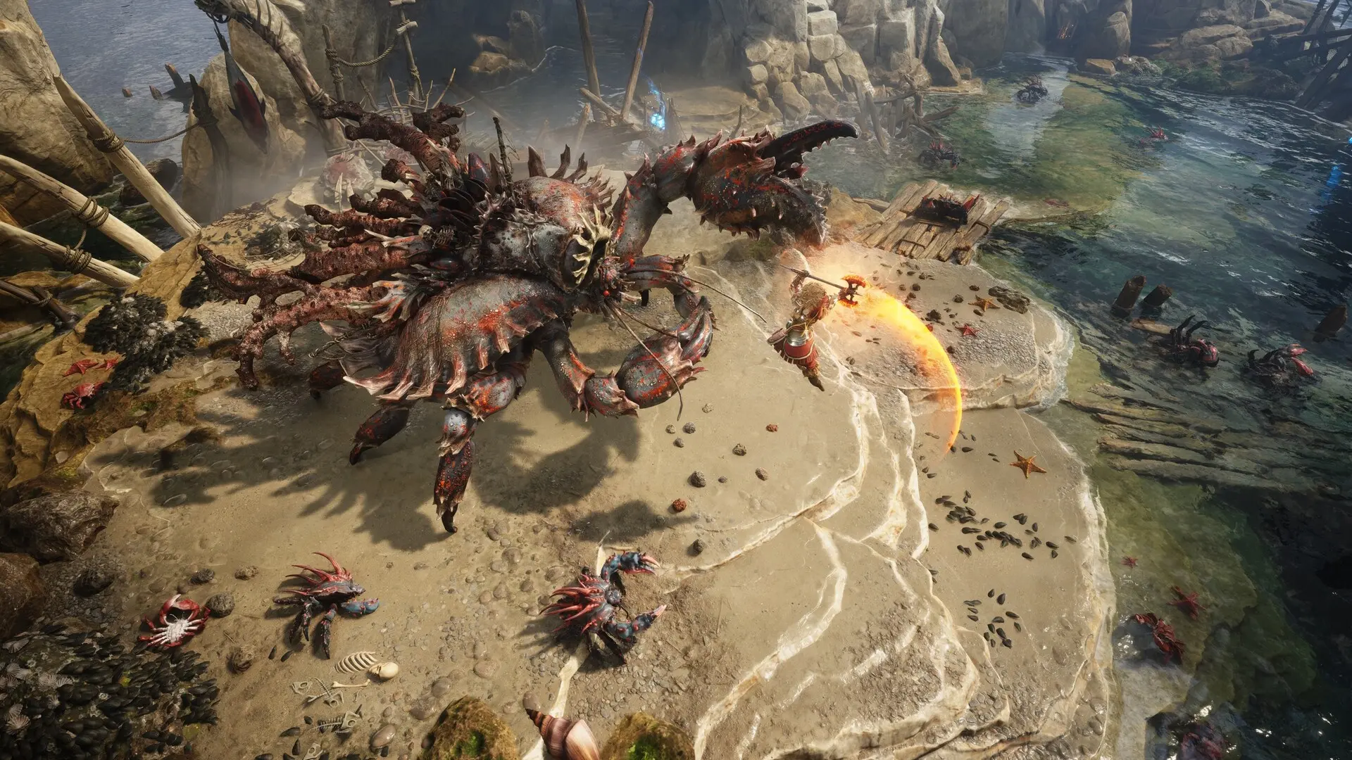 A warrior with an axe leaps at a giant crab monster.