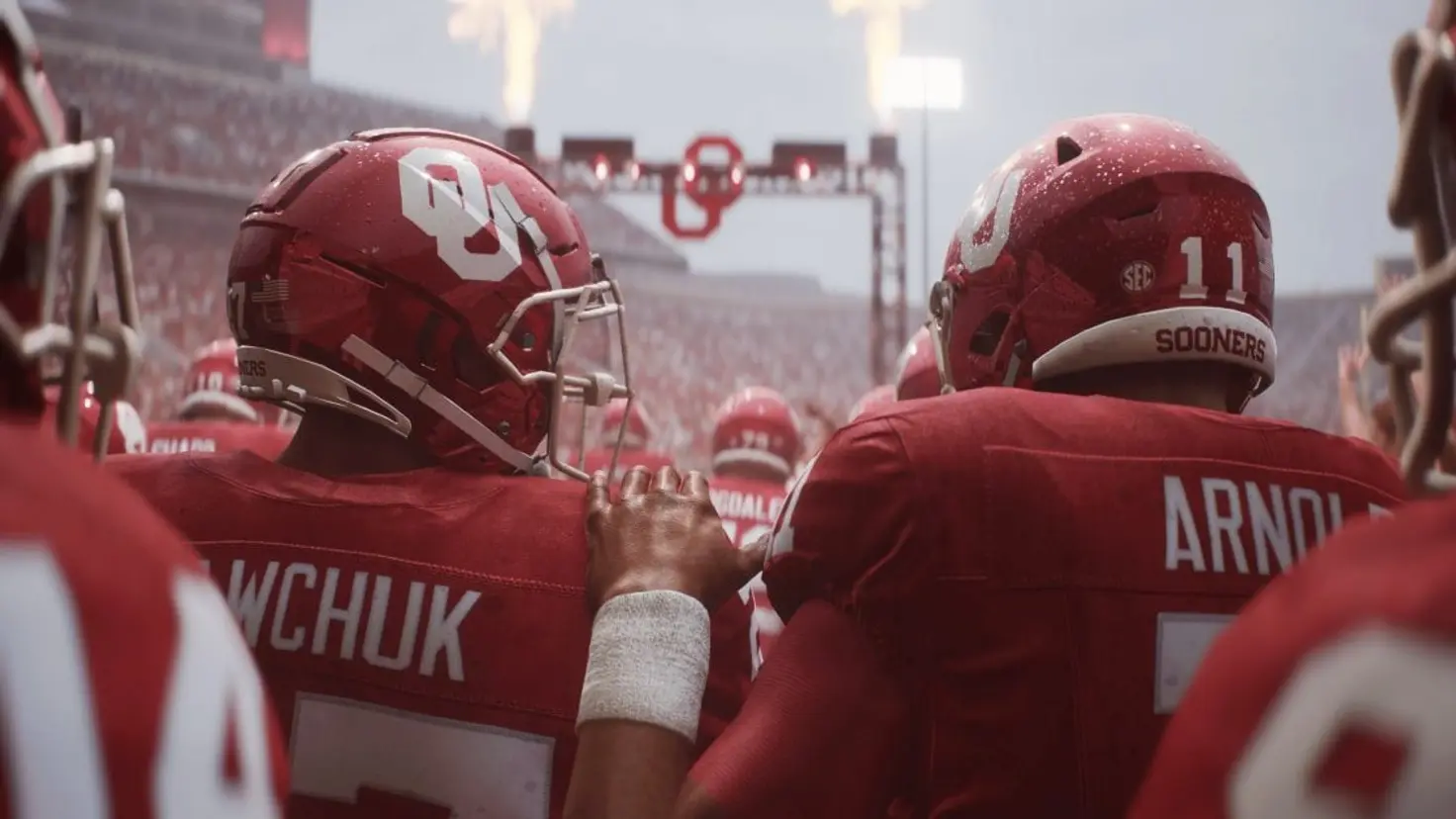 Two Oklahoma University football players prepare to run out onto the field in College Football 25.