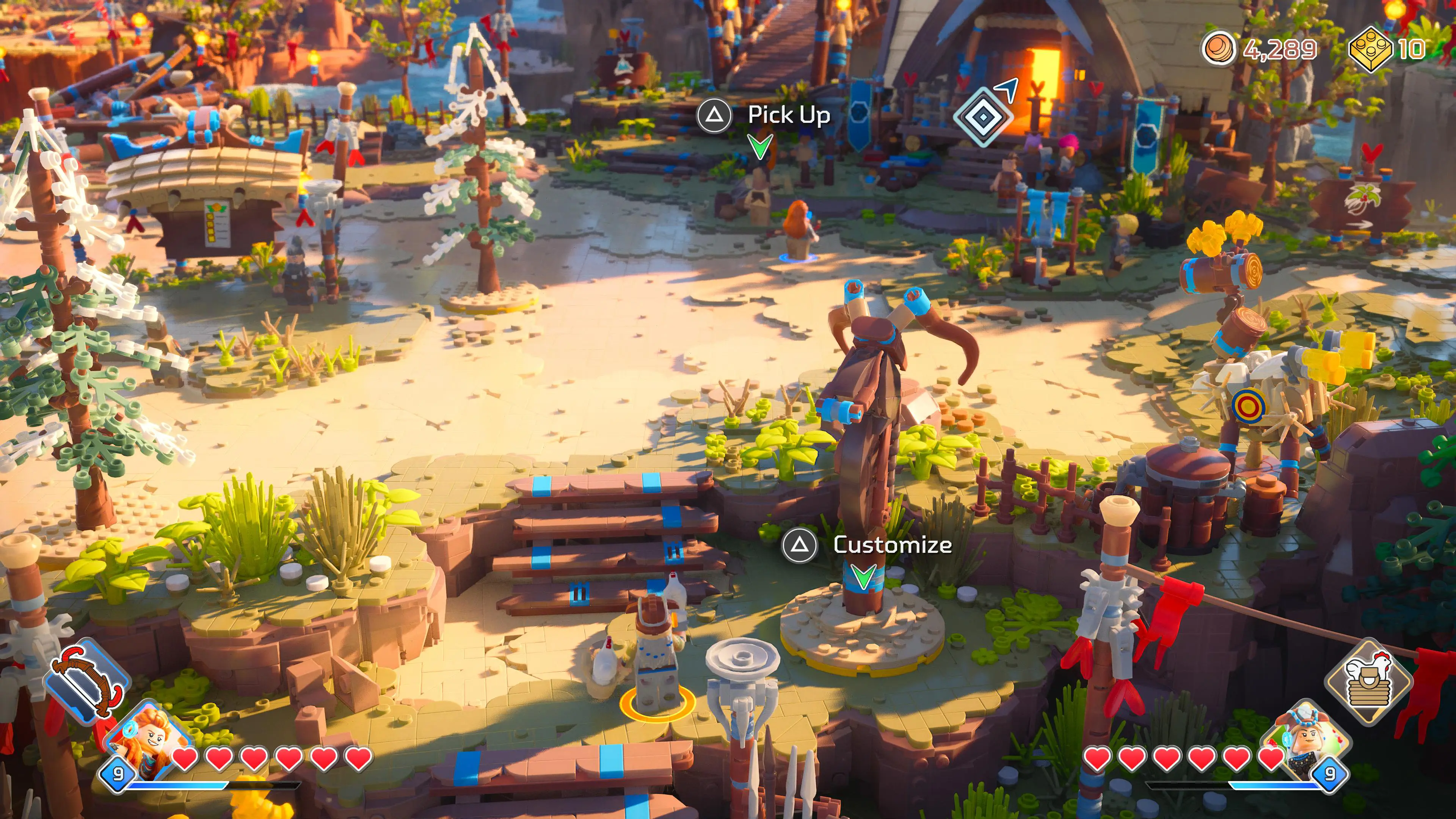 Lego Horizon Adventures screenshot shows the hub area, Mother's Heart, as Aloy and Teersa explore.