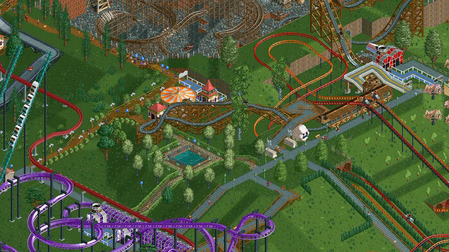 A complex theme park with multiple roller coasters across green hills built in RollerCoaster Tycoon Classic