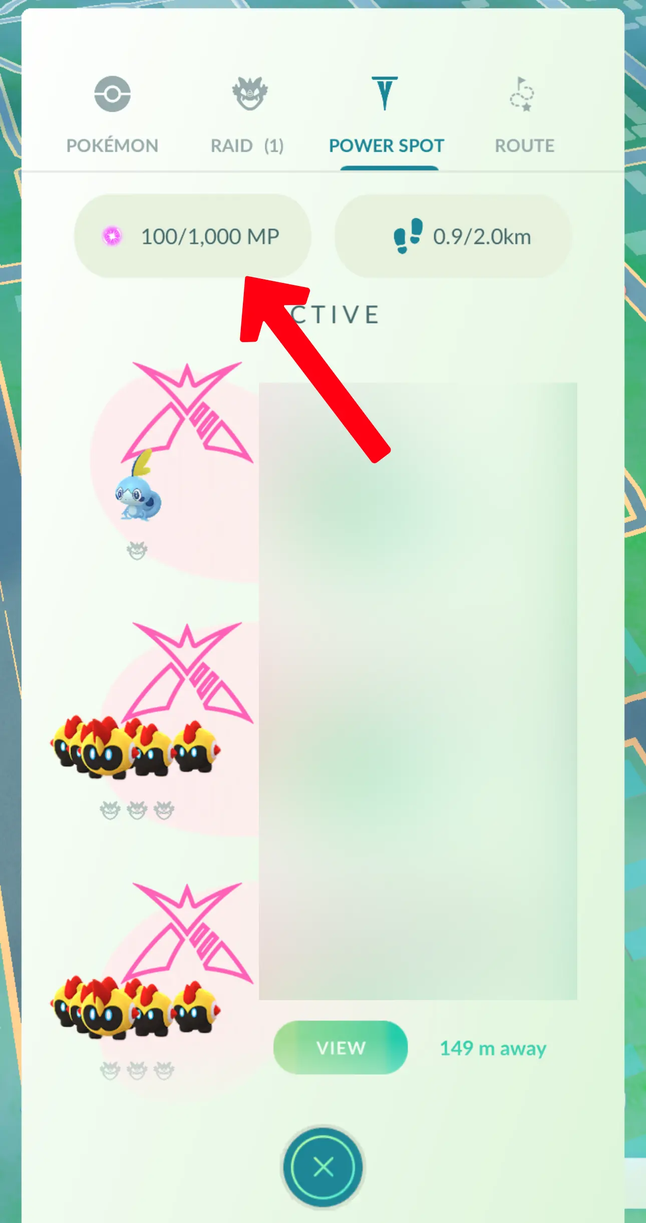 A red arrow pointing at the Power Spot gauge in the Pokemon Go mobile game