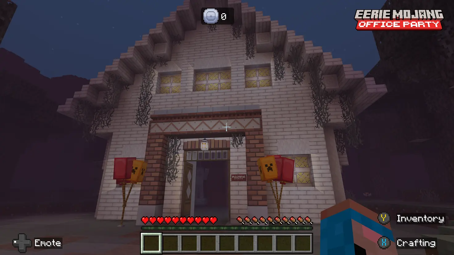 A Minecraft player stands outside a building labeled "Mojang Studios" in the Eerie Mojang Office Party event server in the Minecraft video game