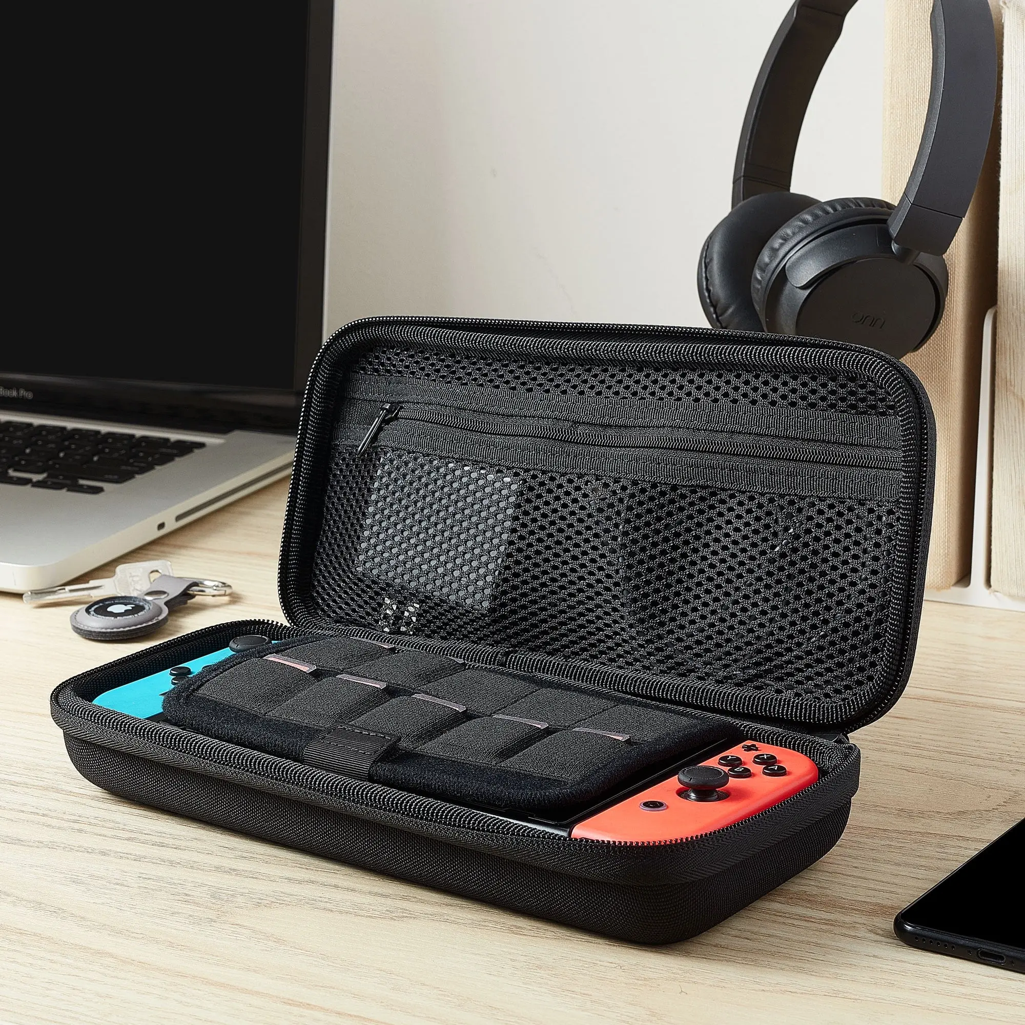 The onn. Hard Shell Carrying Case with Nintendo Switch, charging block and games inside